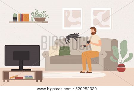 Young Man Watch Tv. Drinking Tea And Watching Televison Show, Spending Weekend On Sofa. Comfortable 