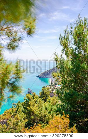 Beautiful Cozy Bay With Boats And Clear Turquoise Water In Italy