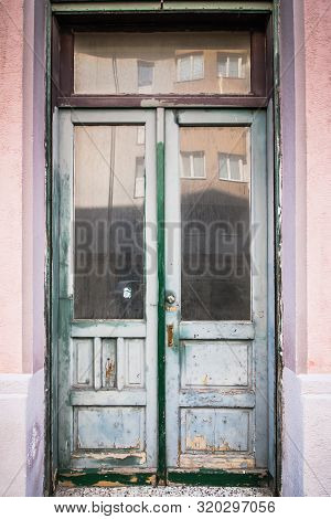 White Wooden White Front Door With Decorative Glass Panels At The Entrance Of A Home. Old, Glass, Pa