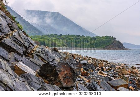 Scenic Landscape Of Rocky Black Sea Coast By Bolshoy Utrish, Anapa, Russia On Green Caucasus Mountai