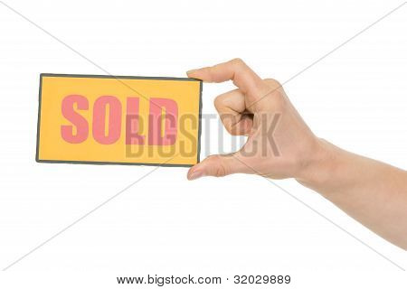 Hand Holding Sold Sign Isolated