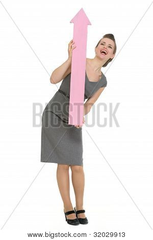 Happy Business Woman With Big Arrow Pointing Up Isolated