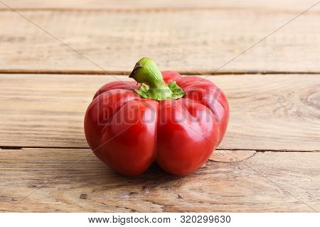 Fresh Red Sweet Pepper Varieties Gogoshar On Wooden Background.