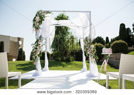 Beautiful Outgoing Wedding Set Up. Jewish Hupa On Romantic Wedding Ceremony , Wedding Outdoor On The
