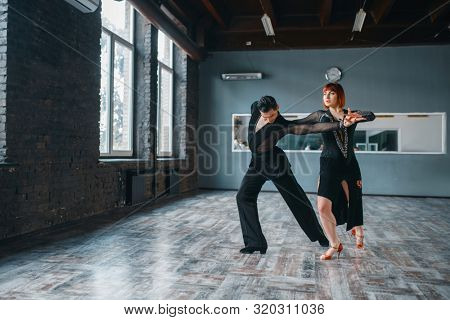 Elegance couple on ballrom dance training in class