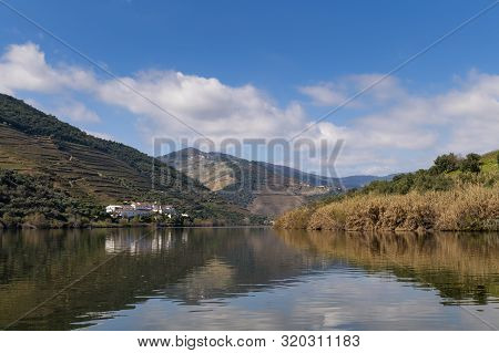 Scenic View Of The Pinhao Village With Terraced Vineyards And The Douro River And The Douro Valley, 