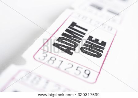 A Macro Or Close-up Shot Of A Strip Of Generic White Sequentially Numbered Admittance Paper Ticket.
