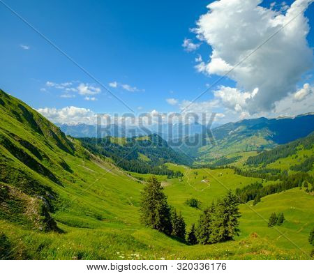 Summer time mountain panoramic landscape in Switzerland near Habkern village