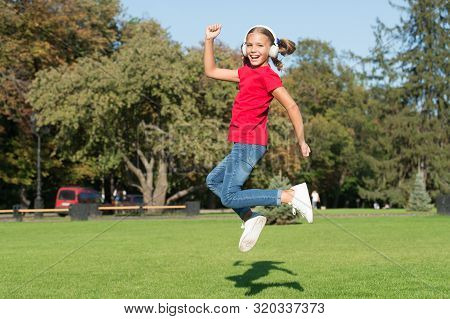 Girl Listening Music Modern Gadget. Kid Happy With Wireless Headset Dancing Running Jumping. Stereo 
