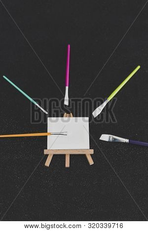 Mini Blank Canvas And Paintbrush With Copyspace