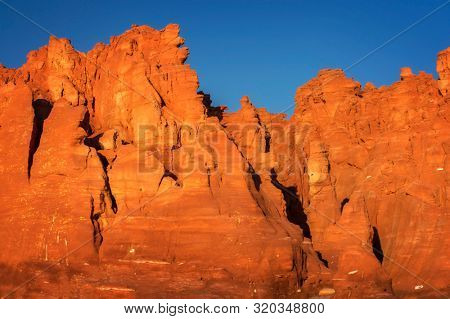 Western Australia â rocky coastline with orange colored rocks at Dampier Peninsula