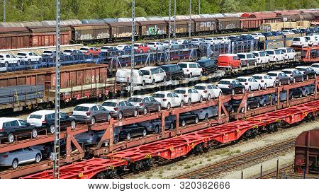 Munich, Germany - July 10, 2019: Lots Of New Cars Loaded On Railway Autorack Wagons And Ready For Sh