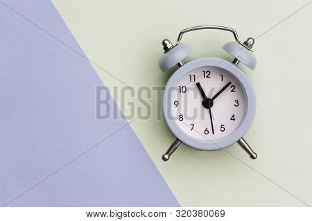 Alarm Clock On A Light Background, The Clock Shows 11 Hours. The Concept Of Exact Time.