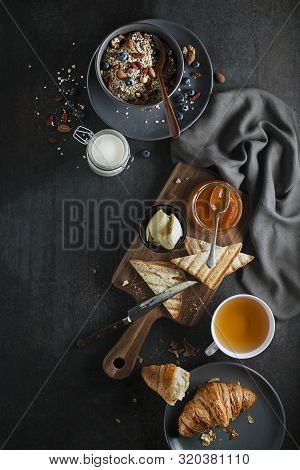 Breakfast Served With Oatmeal And Fruits, Croissants, Jam And Butter. Delicious Healthy Breakfast.