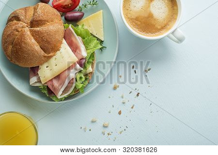 Breakfast Served With Coffee, Juice, Sandwich With Ham, Cheese, Tomato And Lettuce. Continental Deli