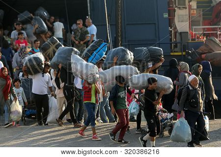 Refugees And Migrants Disembark To The Port Of Thessaloniki After Being Transfered From The Refugee
