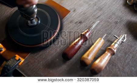 Artisan Working With Leather.