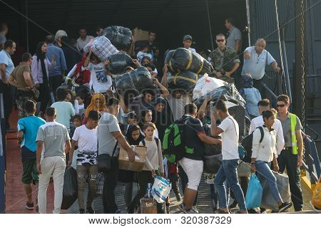 Refugees And Migrants Disembark To The Port Of Thessaloniki After Being Transfered From The Refugee