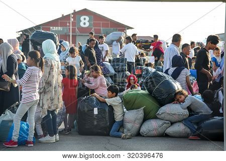Refugees And Migrants Disembark To The Port Of Thessaloniki After Being Transfered From The Refugee