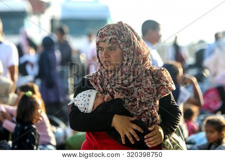 Refugees And Migrants Disembark To The Port Of Thessaloniki After Being Transfered From The Refugee