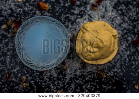 Ubtan/face Mask/face Pack Of Multani Mitti Or Fuller's Earth On Wooden Surface In A Glass Bowl Consi