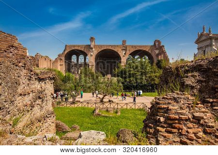 Rome, Italy - April, 2018: Tourists At The Basilica Of Maxentius And Constantine In The Roman Forum 