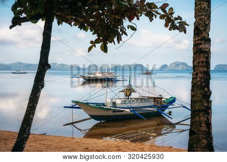 Small Bangka Boats On Corong Corong Beach, El Nido, Philippines