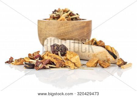 Lot Of Pieces Of Lingonberry Strawberry Fruit Tea In Wooden Bowl With Wooden Scoop Isolated On White
