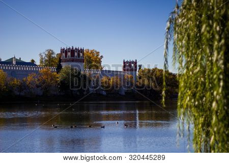 The Pond In The Park Of Novodevichy Monastery On The Background Of Blue Sky In The Autumn. Beautiful