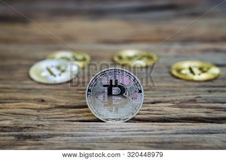 Digital Currency Physical Metal Bitcoin Coin On The Old Wooden Table