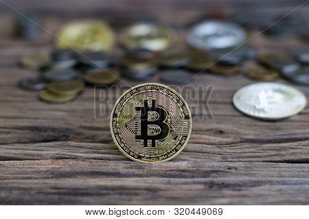 Digital Currency Physical Metal Bitcoin Coin On The Old Wooden Table