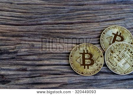 Digital Currency Physical Metal Bitcoin Coin On The Old Wooden Table