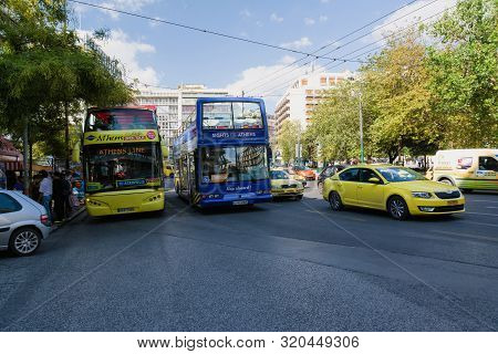 Athens, Greece- September 23, 2016: Tourist Sightseeing Double Decker Busses In Athens, Greece. Athe