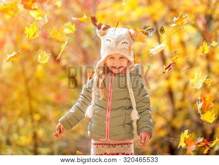 cute little girl in an autumn forest