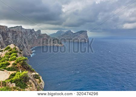 Landscape of rocky coast before a storm under gloomy dramatic sky (cape formentor). Mallorca. Balearic islands. Spain
