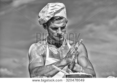 Cook Or Chef With Sexy Muscular Shoulders And Chest Covered With Flour. Chef Cook Preparing Dough Fo