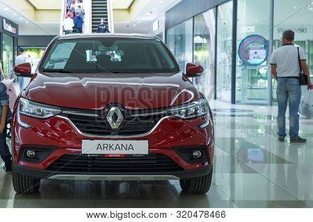 Tyumen, Russia-avg 20, 2019: Red Car Renault Arcana In The Shopping Center Crystal.