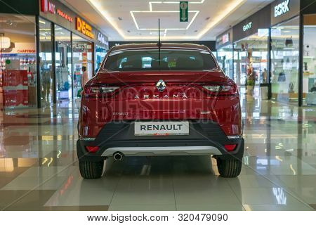 Tyumen, Russia - Avg 20, 2019: The Red Car Renault Arcana Embankment Of The Tura River In The City O