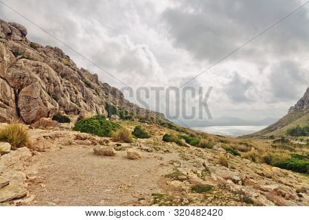 Landscape of rocky coast before a storm under gloomy dramatic sky (cape formentor). Mallorca. Balearic islands. Spain
