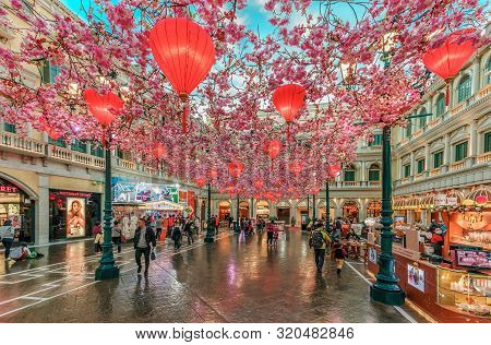 Macao, China - January 24, 2016: Red Chinese Lanterns And Sakura Garlands As Indoor Decorations Unde
