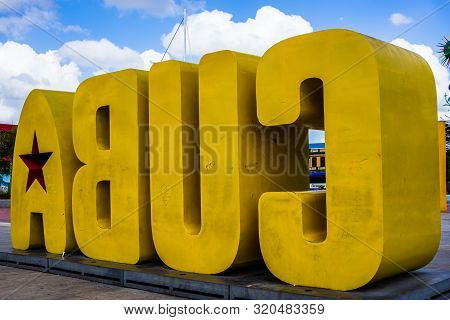 Santiago De Cuba, Cuba - 2019. Big Yellow Cuba Sign On Santiago Waterfront.