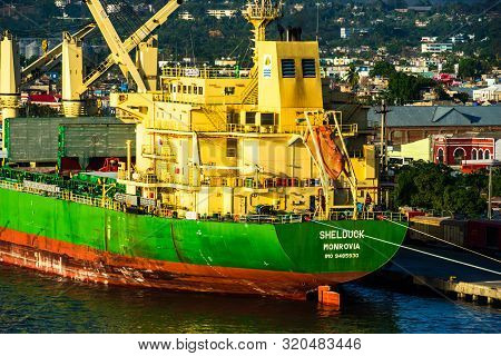 Santiago De Cuba, Cuba - 2019. Old Rusty Ship Docked In The Bay Of Santiago De Cuba.
