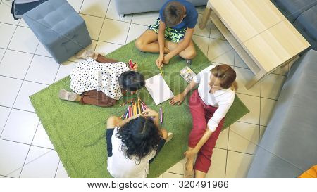 The Concept Of Childrens Group Psychotherapy. Female Psychologist Conducts A Group Consultation With