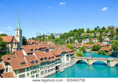 Bern, The Capital Of Switzerland, With Dominant Nydegg Church And Historical Center Located Along Tu