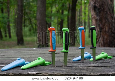 Multi-colored Knives Plastic Cases. Knives With Colored Handles And Covers.