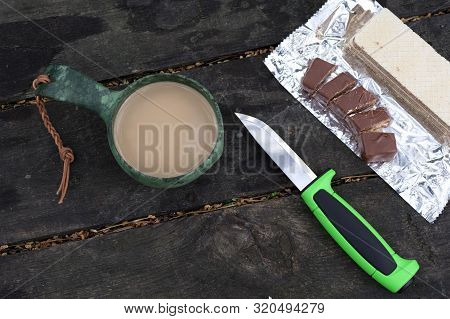 Knife, Coffee And Chocolate. Tourist Snack. Coffee With Milk.