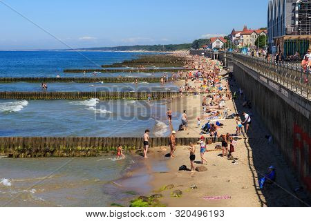 Zelenogradsk, Kaliningrad Region, Russia - June 18, 2019: Unknown People Resting On A Sandy Beach On