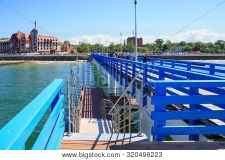 Zelenogradsk, Kaliningrad Region, Russia - June 18, 2019: View Of The Pedestrian Long Mole On The Ba