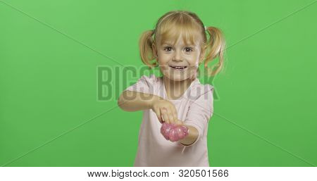Child Having Fun Making Ping Slime. Kid Playing With Hand Made Toy Slime. Funny Kid Girl. Relax And 