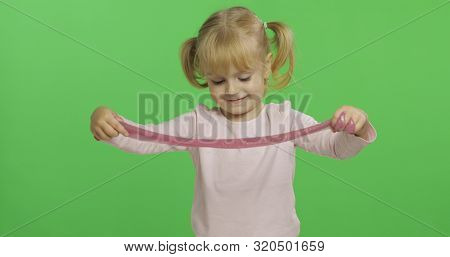 Child Having Fun Making Ping Slime. Kid Playing With Hand Made Toy Slime. Funny Kid Girl. Relax And 
